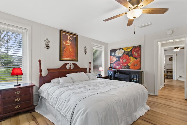 85 N Saint Augustine Blvd Unit 1, Saint Augustine, FL 32080 - bedroom with light wood-style floors, multiple windows, and a ceiling fan