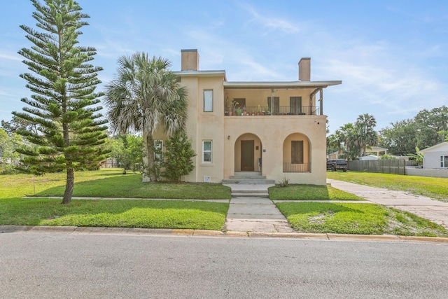 85 N Saint Augustine Blvd Unit 1, Saint Augustine, FL 32080 - mediterranean / spanish home with a balcony, stucco siding, and a chimney