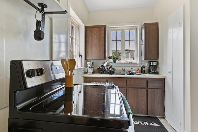 85 N Saint Augustine Blvd Unit 1, Saint Augustine, FL 32080 - kitchen with stainless steel electric stove, a sink, and light countertops