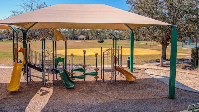 communal playground featuring a lawn