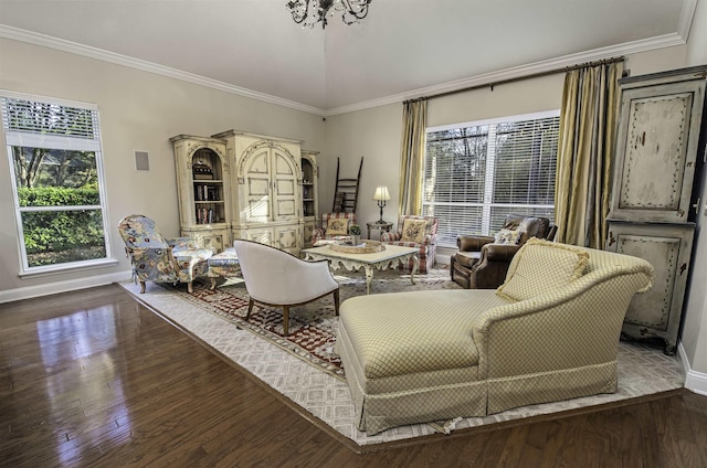 sitting room featuring ornamental molding, dark wood finished floors, and baseboards