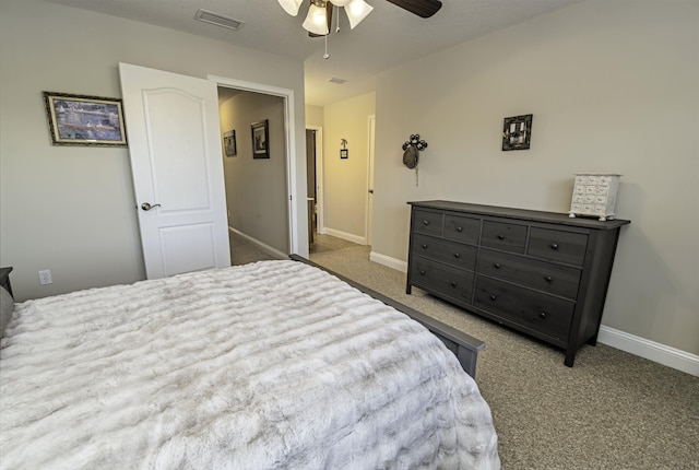 bedroom featuring carpet, visible vents, ceiling fan, and baseboards