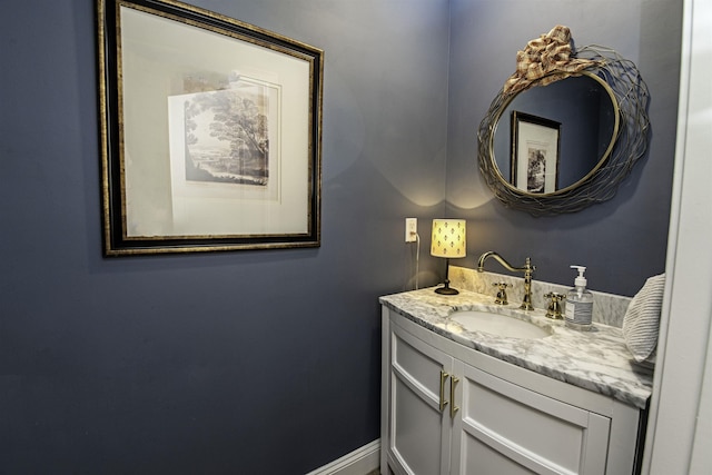 bathroom featuring vanity and baseboards