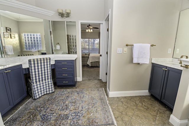 full bathroom featuring ensuite bathroom, ornamental molding, ceiling fan, vanity, and baseboards