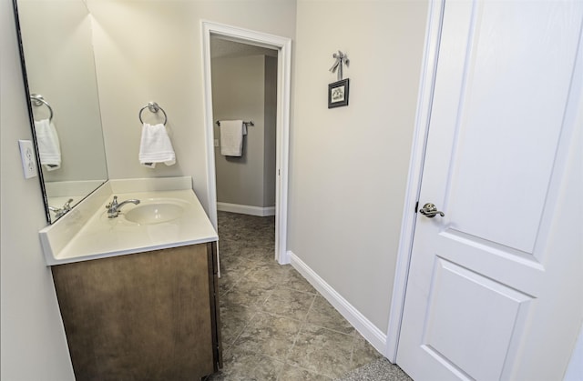 bathroom featuring vanity and baseboards