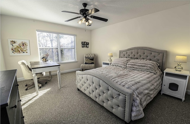 bedroom featuring a textured ceiling, ceiling fan, dark carpet, and baseboards