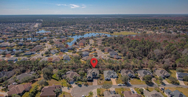 birds eye view of property featuring a water view and a residential view