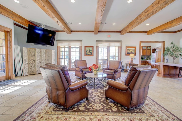 living area with beam ceiling and recessed lighting