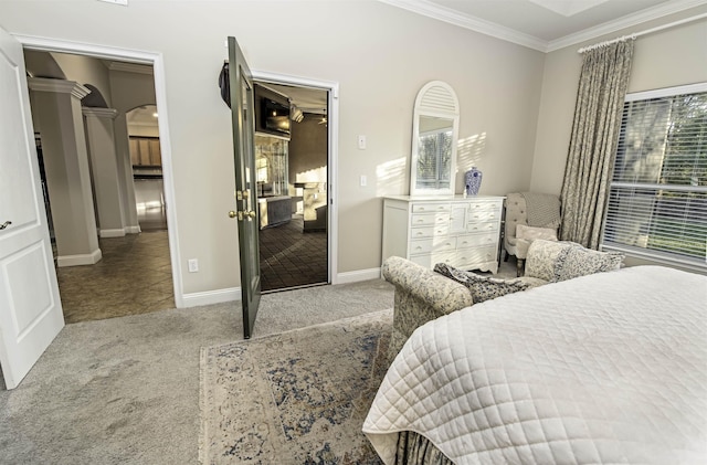 bedroom with arched walkways, ornamental molding, baseboards, and light colored carpet