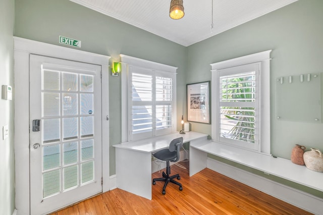 home office with light hardwood / wood-style floors