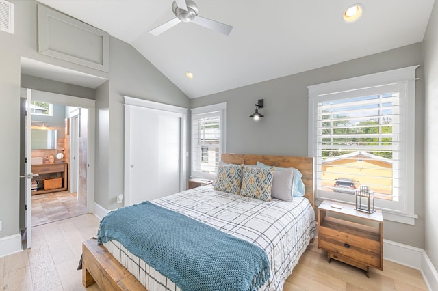 bedroom with ceiling fan, lofted ceiling, light wood-type flooring, and multiple windows