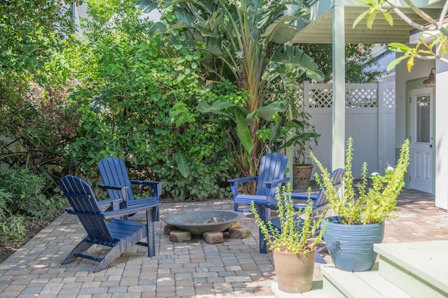 view of patio with a fire pit