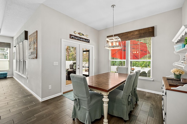 dining area with french doors, baseboards, and wood finish floors