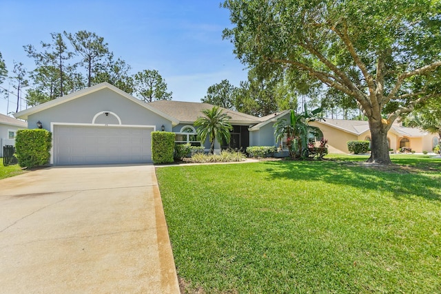 ranch-style house with an attached garage, concrete driveway, a front yard, and stucco siding
