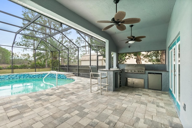 outdoor pool featuring area for grilling, a grill, a patio, a lanai, and exterior bar