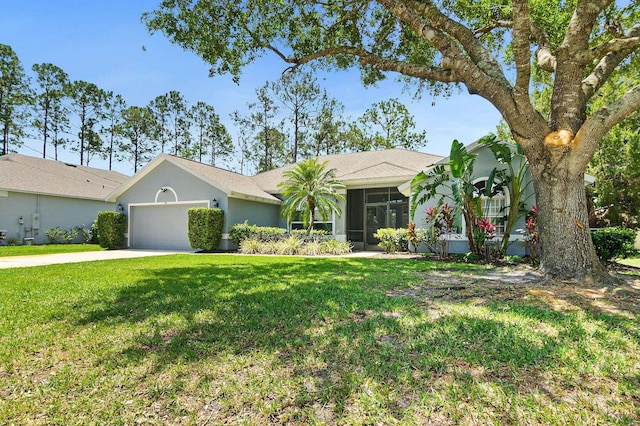 ranch-style house featuring a garage, a front lawn, a sunroom, stucco siding, and driveway