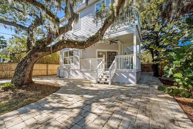 view of front of house with a patio and ceiling fan