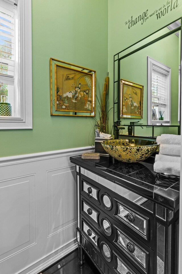 living room with ceiling fan, ornamental molding, a wealth of natural light, and a tray ceiling