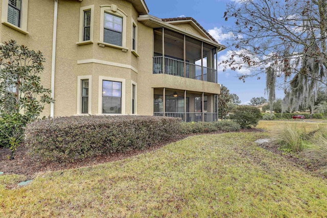 rear view of property with a yard