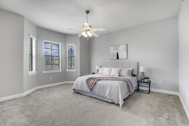 bedroom with light carpet and ceiling fan