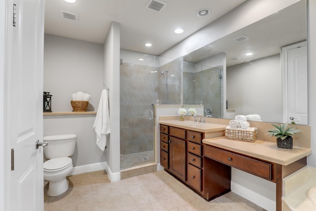 bathroom featuring vanity, tile patterned flooring, toilet, and walk in shower