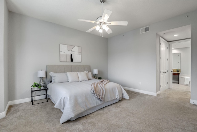 bedroom with ceiling fan and light colored carpet