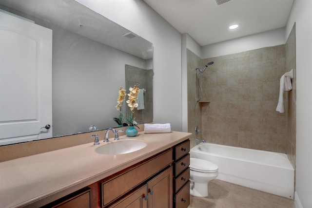 full bathroom with tiled shower / bath combo, vanity, tile patterned flooring, and toilet