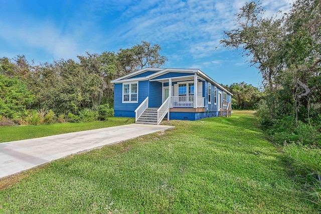 4954 A1A, Saint Augustine, FL 32080 - view of front of house featuring a porch, crawl space, and a front lawn