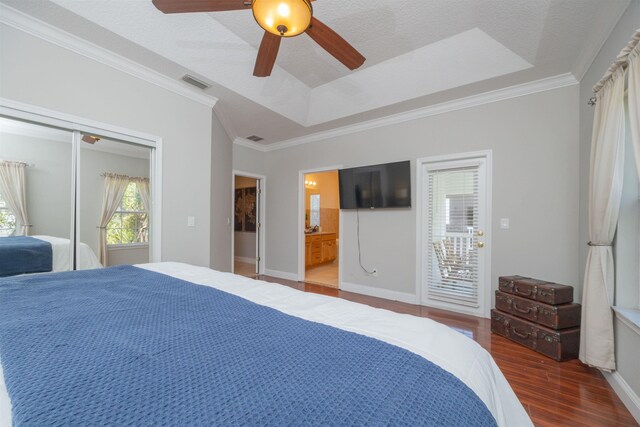 2 Lisbon St, Saint Augustine, FL 32080 - bedroom with wood finished floors, ornamental molding, a closet, baseboards, and a ceiling fan