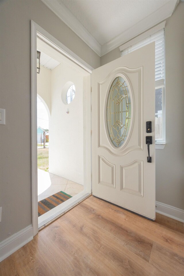 2 Lisbon St, Saint Augustine, FL 32080 - office featuring ornamental molding, light wood-style floors, baseboards, and a chandelier