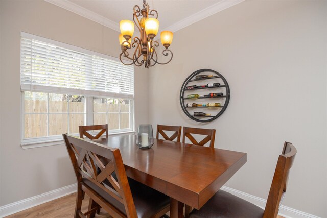 2 Lisbon St, Saint Augustine, FL 32080 - living area with a ceiling fan, light wood-style floors, a tray ceiling, baseboards, and crown molding