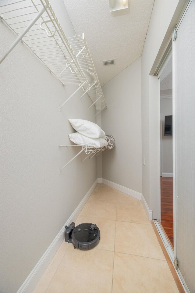 2 Lisbon St, Saint Augustine, FL 32080 - bathroom with crown molding, tile patterned floors, a garden tub, double vanity, and plenty of natural light