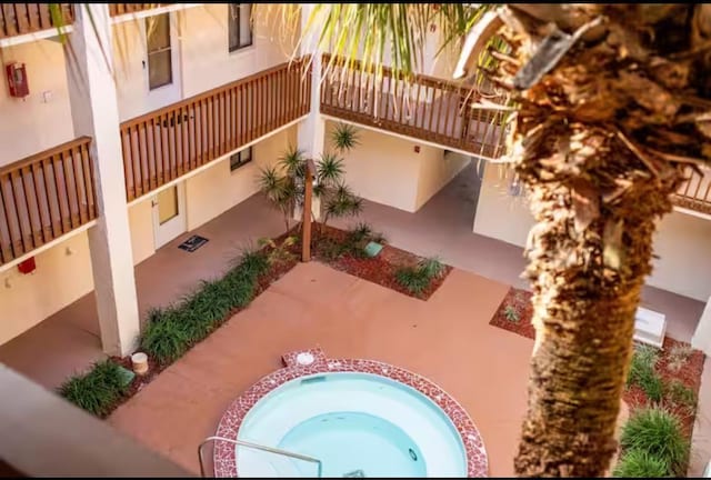 880 A1A Beach Blvd, Saint Augustine Beach, FL 32080 - view of property's community with a jacuzzi and a patio area