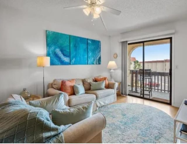 880 A1A Beach Blvd, Saint Augustine Beach, FL 32080 - living room featuring a textured ceiling, ceiling fan, and wood finished floors