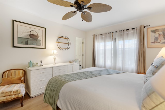 bedroom with ceiling fan and light wood-type flooring