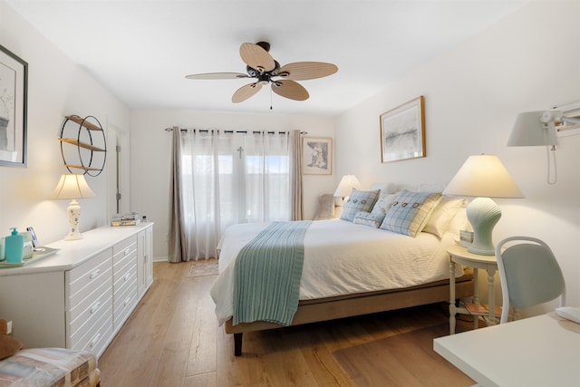 bedroom featuring ceiling fan and light hardwood / wood-style flooring