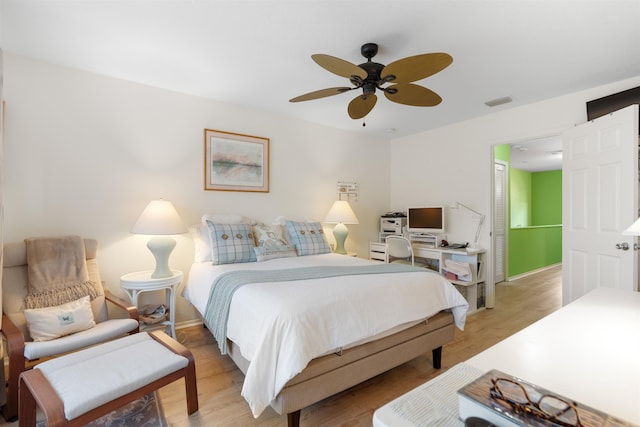 bedroom featuring ceiling fan and light hardwood / wood-style flooring