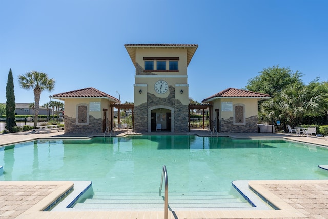 view of swimming pool featuring a patio area