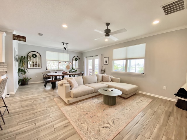 118 Sierras Loop, Saint Augustine, FL 32086 - living room with light wood-style flooring, healthy amount of natural light, ornamental molding, ceiling fan, and recessed lighting