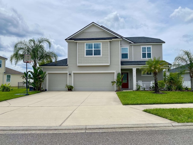118 Sierras Loop, Saint Augustine, FL 32086 - view of front of house featuring covered porch, a garage, driveway, and a front yard