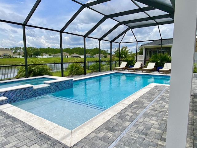 118 Sierras Loop, Saint Augustine, FL 32086 - view of swimming pool featuring a water view, a pool with connected hot tub, and a patio area