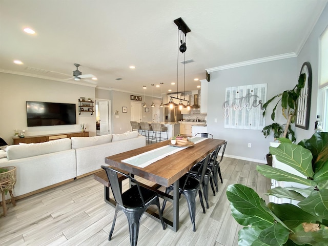 118 Sierras Loop, Saint Augustine, FL 32086 - dining room featuring crown molding, recessed lighting, ceiling fan, and light wood-style flooring