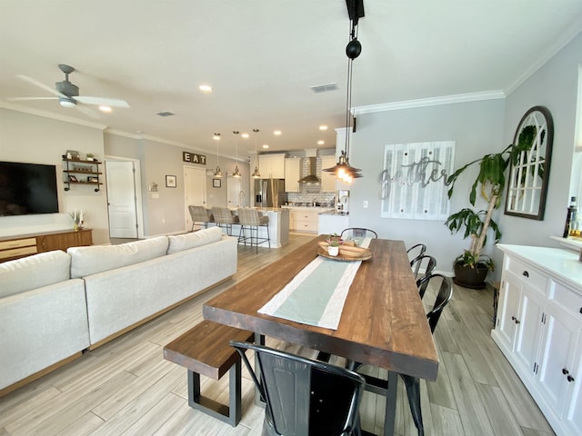 118 Sierras Loop, Saint Augustine, FL 32086 - dining space with ornamental molding, a ceiling fan, recessed lighting, and light wood-type flooring