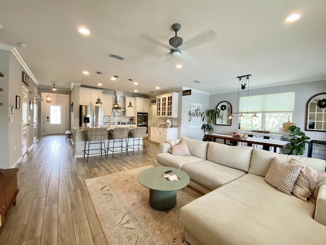 118 Sierras Loop, Saint Augustine, FL 32086 - living area featuring ornamental molding, ceiling fan, light wood-style flooring, and recessed lighting