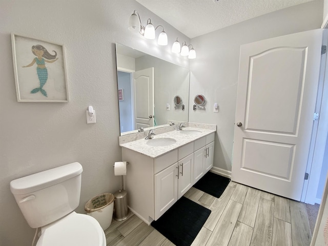 118 Sierras Loop, Saint Augustine, FL 32086 - full bath with double vanity, wood finish floors, and a textured ceiling