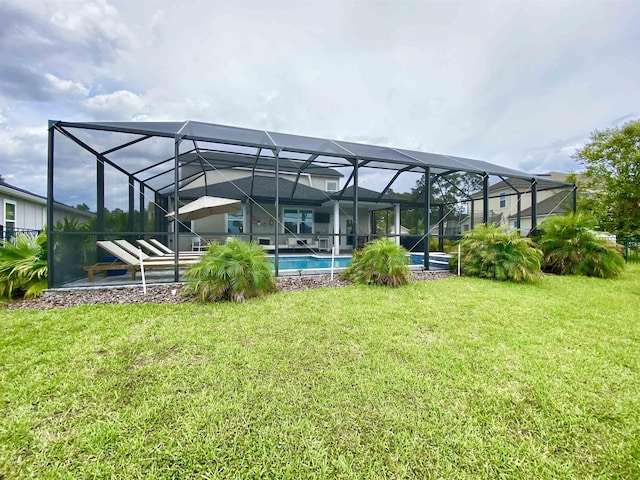 118 Sierras Loop, Saint Augustine, FL 32086 - back of house featuring a lawn and an outdoor pool