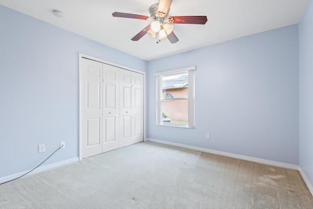 4 Eastgate Ln, Palm Coast, FL 32164 - unfurnished bedroom with carpet flooring, a closet, baseboards, and ceiling fan