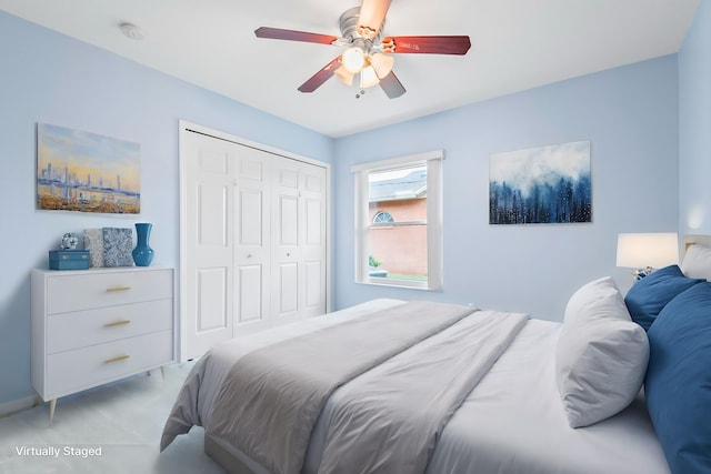 4 Eastgate Ln, Palm Coast, FL 32164 - bedroom featuring a closet, a ceiling fan, and light carpet