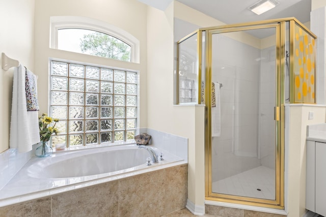 4 Eastgate Ln, Palm Coast, FL 32164 - bathroom with a shower stall, a garden tub, and tile patterned floors