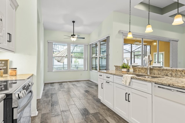 4 Eastgate Ln, Palm Coast, FL 32164 - kitchen featuring dishwasher, stainless steel range with electric stovetop, a sink, ceiling fan, and plenty of natural light